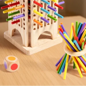 Motorické dovednostní hry Detail barevných tyčinek, dřevěné věže a kuliček motorické dovednostní hry.